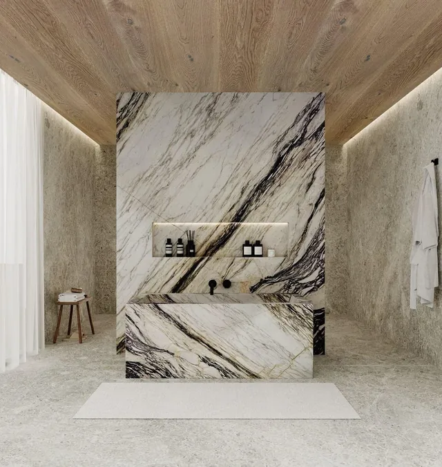 Book-matched marble vanity wall with bold black veins in a bathroom